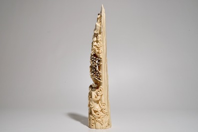 A Chinese carved ivory tusk with a marriage scene, ca. 1900